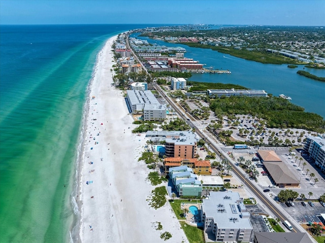 birds eye view of property with a view of the beach and a water view