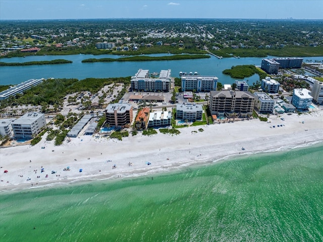 birds eye view of property featuring a city view, a water view, and a beach view