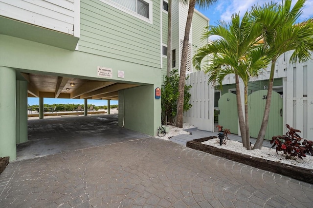 exterior space with driveway and a carport
