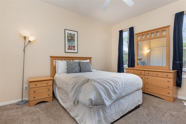 bedroom featuring carpet, baseboards, and a ceiling fan