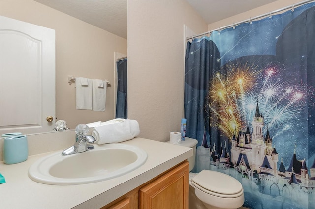 full bathroom featuring vanity and toilet