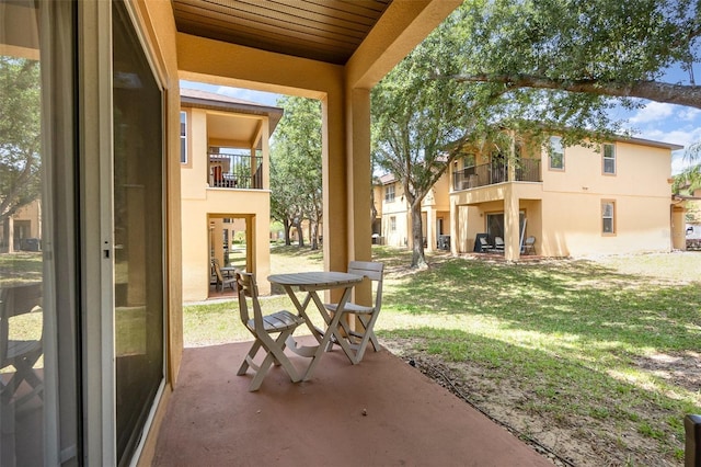 view of patio with a balcony