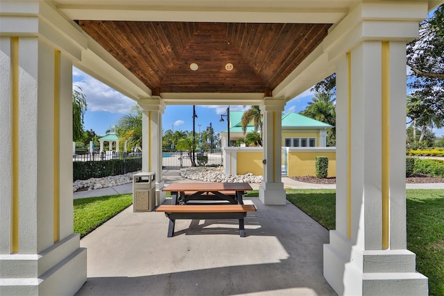 view of patio featuring fence