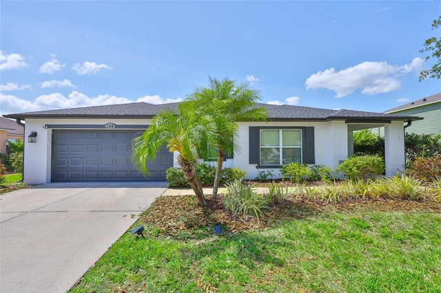ranch-style house with concrete driveway, stucco siding, and an attached garage