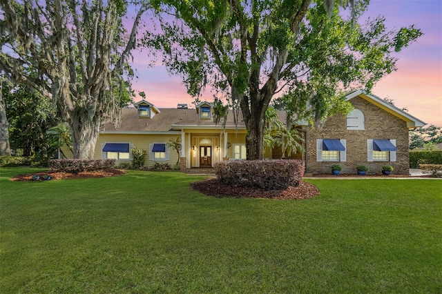 2769 St Andrews Blvd, Tarpon Springs, FL 34688 - view of front facade with a lawn