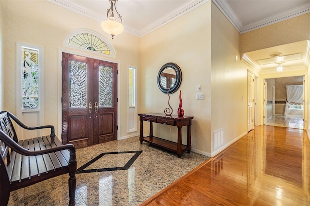 2769 St Andrews Blvd, Tarpon Springs, FL 34688 - foyer entrance with ornamental molding, healthy amount of natural light, and baseboards