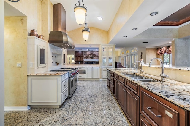 2769 St Andrews Blvd, Tarpon Springs, FL 34688 - kitchen with stainless steel stove, a sink, island range hood, white cabinetry, and light stone countertops