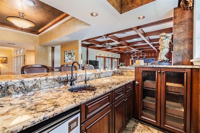 2769 St Andrews Blvd, Tarpon Springs, FL 34688 - kitchen with a sink, light stone counters, ceiling fan, coffered ceiling, and dishwasher