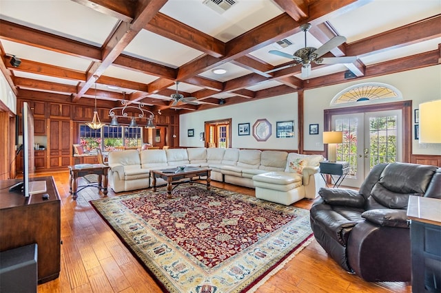 2769 St Andrews Blvd, Tarpon Springs, FL 34688 - living room with a ceiling fan, coffered ceiling, beam ceiling, french doors, and light wood-type flooring