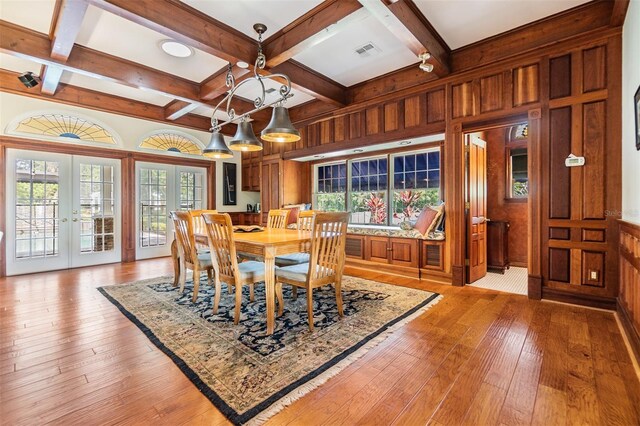 2769 St Andrews Blvd, Tarpon Springs, FL 34688 - dining room with french doors, coffered ceiling, light wood-type flooring, and beamed ceiling