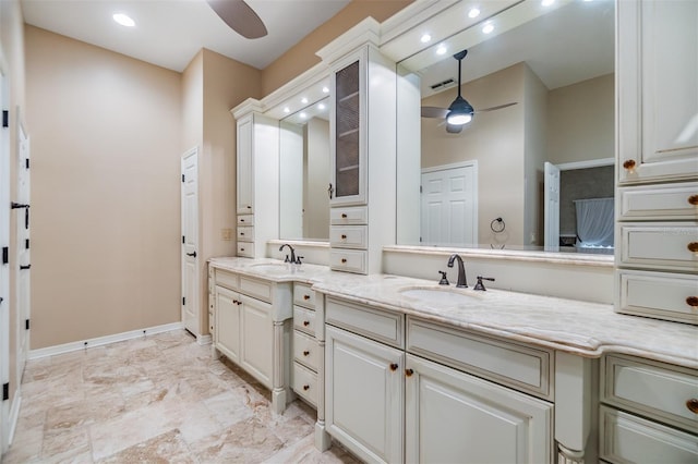 2769 St Andrews Blvd, Tarpon Springs, FL 34688 - bathroom featuring a ceiling fan, double vanity, recessed lighting, and baseboards