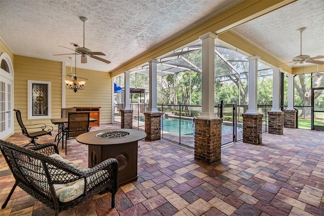 2769 St Andrews Blvd, Tarpon Springs, FL 34688 - view of patio / terrace with ceiling fan, a fire pit, and a lanai