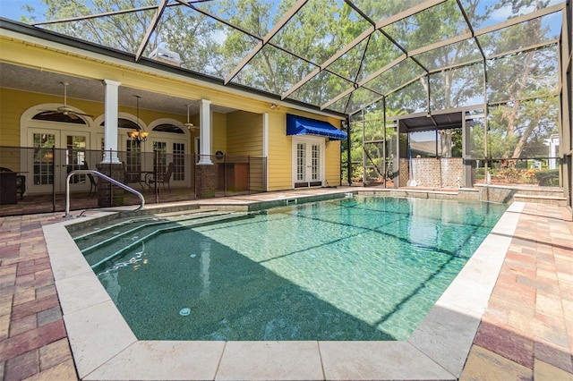 2769 St Andrews Blvd, Tarpon Springs, FL 34688 - swimming pool with french doors, a patio, and a ceiling fan