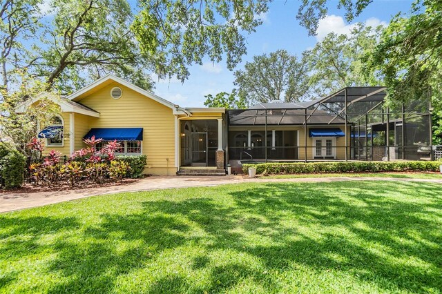 2769 St Andrews Blvd, Tarpon Springs, FL 34688 - view of front of home featuring a front yard and a lanai