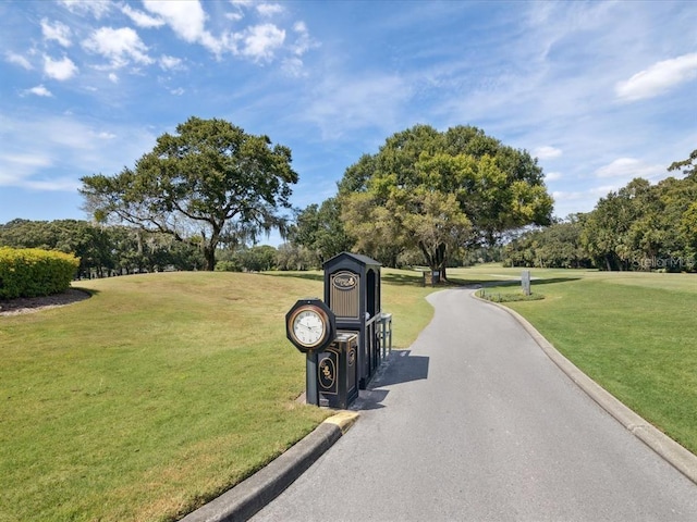 2769 St Andrews Blvd, Tarpon Springs, FL 34688 - view of road with view of wooded area and curbs