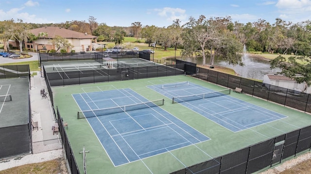 2769 St Andrews Blvd, Tarpon Springs, FL 34688 - view of tennis court featuring view of scattered trees