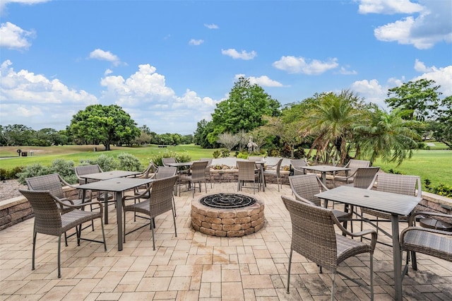 2769 St Andrews Blvd, Tarpon Springs, FL 34688 - view of patio / terrace featuring an outdoor fire pit and outdoor dining area