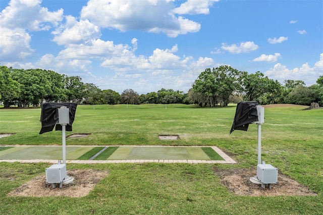 2769 St Andrews Blvd, Tarpon Springs, FL 34688 - view of home's community featuring view of wooded area and a lawn