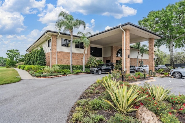 2769 St Andrews Blvd, Tarpon Springs, FL 34688 - view of property featuring a carport and driveway
