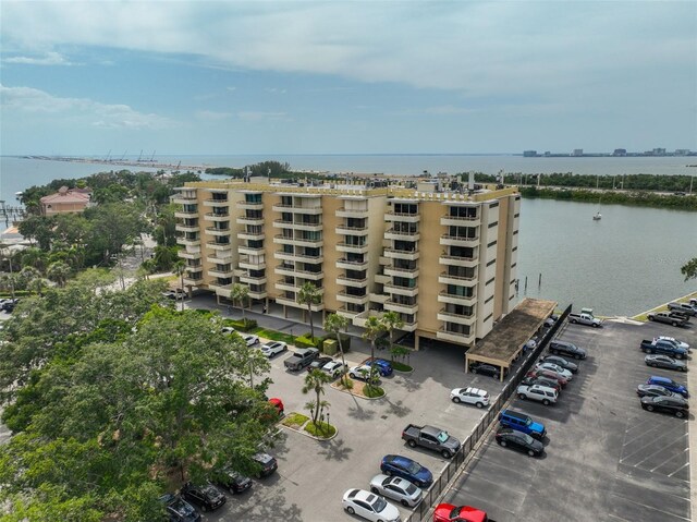 5701 Mariner St Unit 701, Tampa, FL 33609 - view of apartment building / complex featuring uncovered parking and a water view