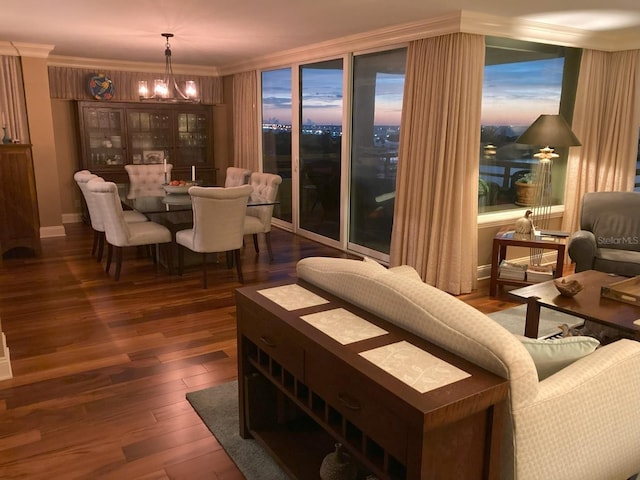 5701 Mariner St Unit 701, Tampa, FL 33609 - dining area featuring a chandelier, wood-type flooring, and crown molding