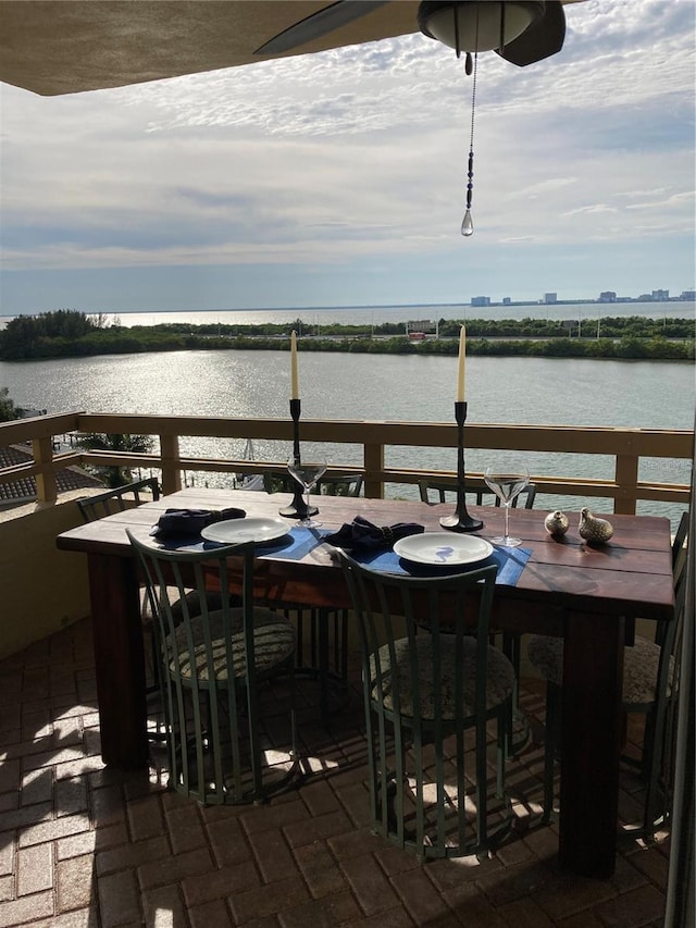 5701 Mariner St Unit 701, Tampa, FL 33609 - balcony featuring outdoor dining area and a water view
