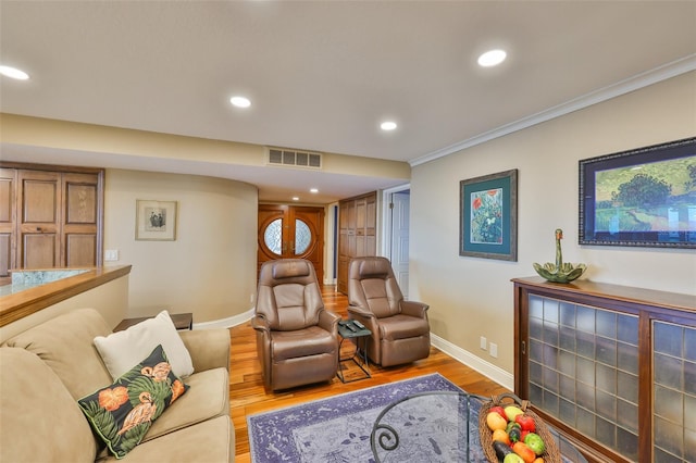 5701 Mariner St Unit 701, Tampa, FL 33609 - living area with light wood-style flooring, baseboards, recessed lighting, and crown molding