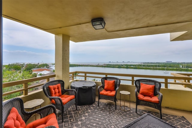5701 Mariner St Unit 701, Tampa, FL 33609 - balcony with a water view and an outdoor living space