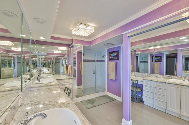 5701 Mariner St Unit 701, Tampa, FL 33609 - bathroom with ornamental molding, a stall shower, vanity, tile patterned flooring, and baseboards