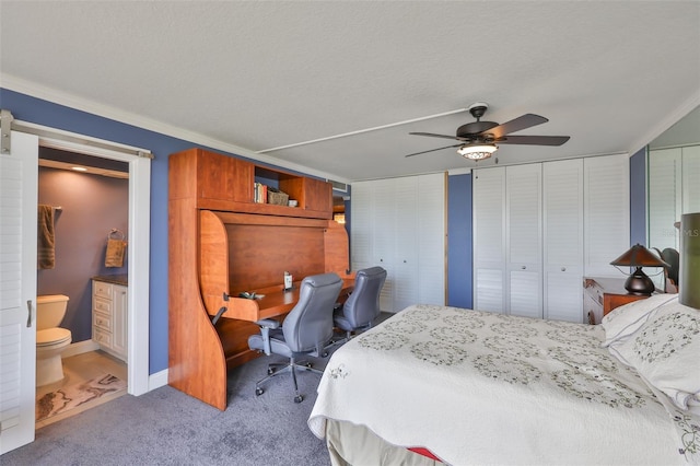 5701 Mariner St Unit 701, Tampa, FL 33609 - bedroom featuring carpet flooring, multiple closets, ensuite bath, crown molding, and a ceiling fan