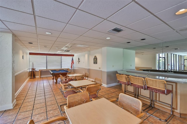 5701 Mariner St Unit 701, Tampa, FL 33609 - dining space featuring billiards, plenty of natural light, baseboards, a paneled ceiling, and light tile patterned floors