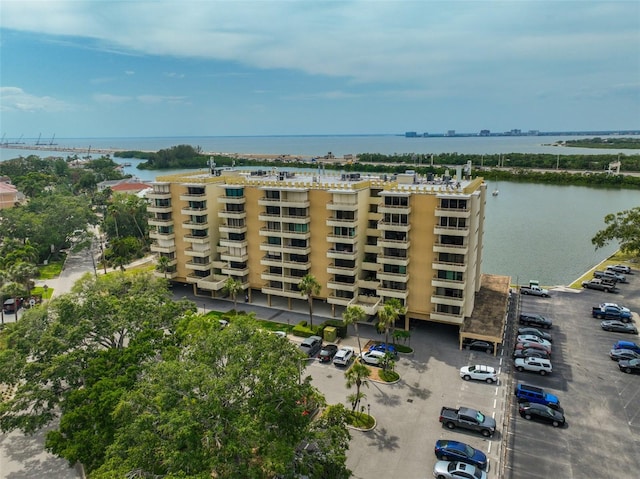 5701 Mariner St Unit 701, Tampa, FL 33609 - view of apartment building / complex featuring uncovered parking and a water view