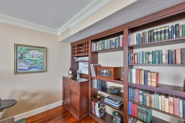 5701 Mariner St Unit 701, Tampa, FL 33609 - office space with a textured ceiling, ornamental molding, dark wood-type flooring, and baseboards