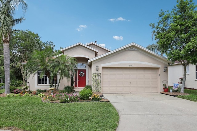 13813 Sigler St, Riverview, FL 33579 - ranch-style home with concrete driveway, stucco siding, an attached garage, and a front lawn