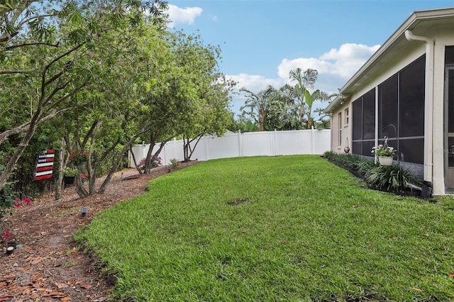 13813 Sigler St, Riverview, FL 33579 - view of yard with a sunroom and a fenced backyard