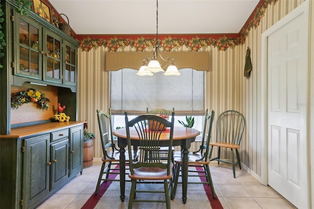 13813 Sigler St, Riverview, FL 33579 - dining room with light tile patterned floors, a notable chandelier, wallpapered walls, and baseboards