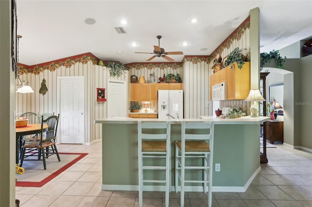 13813 Sigler St, Riverview, FL 33579 - kitchen featuring white appliances, visible vents, ceiling fan, light countertops, and wallpapered walls