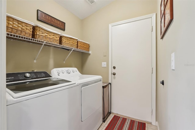 13813 Sigler St, Riverview, FL 33579 - washroom featuring washing machine and clothes dryer, laundry area, light tile patterned flooring, and visible vents