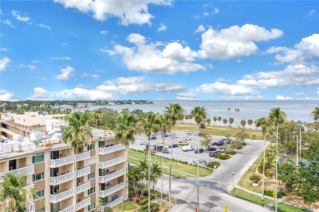 aerial view of a nearby body of water and apartment complex / building