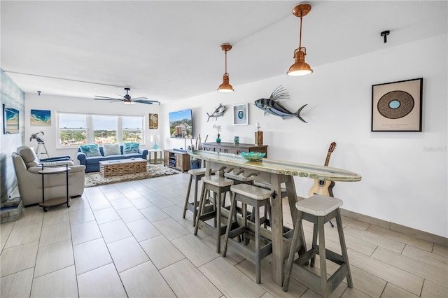 dining space with ceiling fan