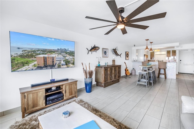 living area featuring a ceiling fan