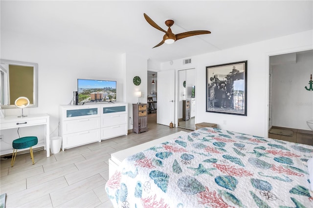 bedroom with a ceiling fan and connected bathroom