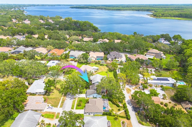 aerial perspective of suburban area with a large body of water