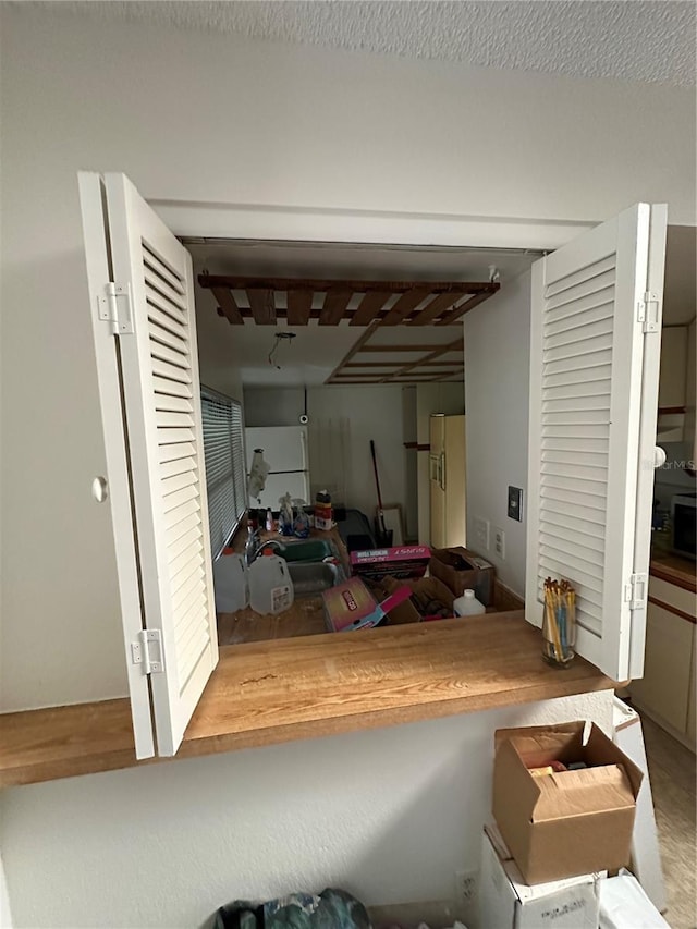 135 Pinewinds Blvd, Oldsmar, FL 34677 - garage featuring white refrigerator with ice dispenser and freestanding refrigerator