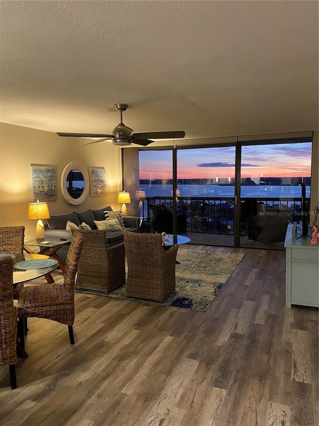 400 Island Way Unit 1709, Clearwater Beach, FL 33767 - living room featuring wood finished floors, a ceiling fan, and a textured ceiling