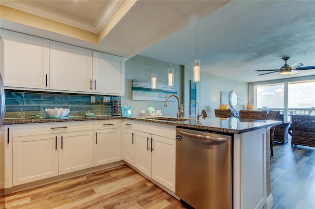 400 Island Way Unit 1709, Clearwater Beach, FL 33767 - kitchen featuring dishwasher, a peninsula, crown molding, a sink, and light wood-type flooring