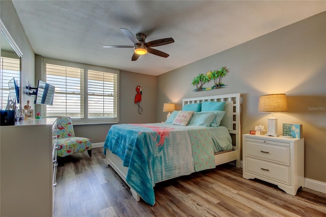 400 Island Way Unit 1709, Clearwater Beach, FL 33767 - bedroom with light wood-style flooring, baseboards, and ceiling fan