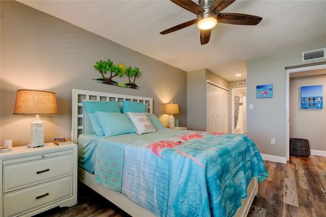 400 Island Way Unit 1709, Clearwater Beach, FL 33767 - bedroom featuring dark wood-style flooring, baseboards, a closet, and a ceiling fan
