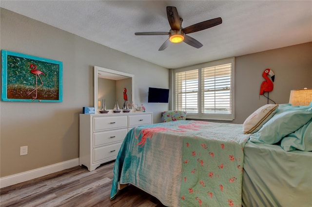 400 Island Way Unit 1709, Clearwater Beach, FL 33767 - bedroom with light wood-type flooring, baseboards, and ceiling fan