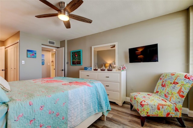 400 Island Way Unit 1709, Clearwater Beach, FL 33767 - bedroom with light wood-style flooring, a ceiling fan, and baseboards